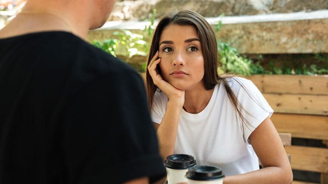 young women ignore man in café