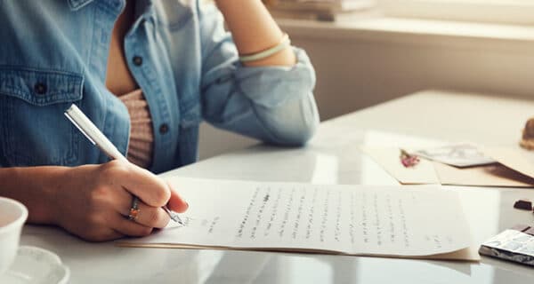 caucasian-woman-writing-letter