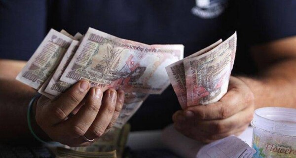 man counting money