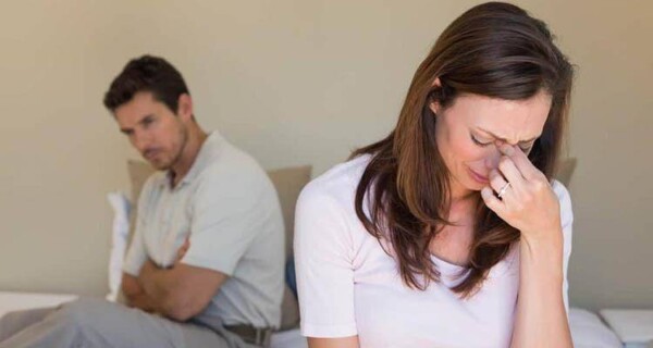 woman crying infront of man