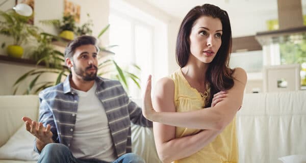 upset-couple-arguing-with-each-other-sofa