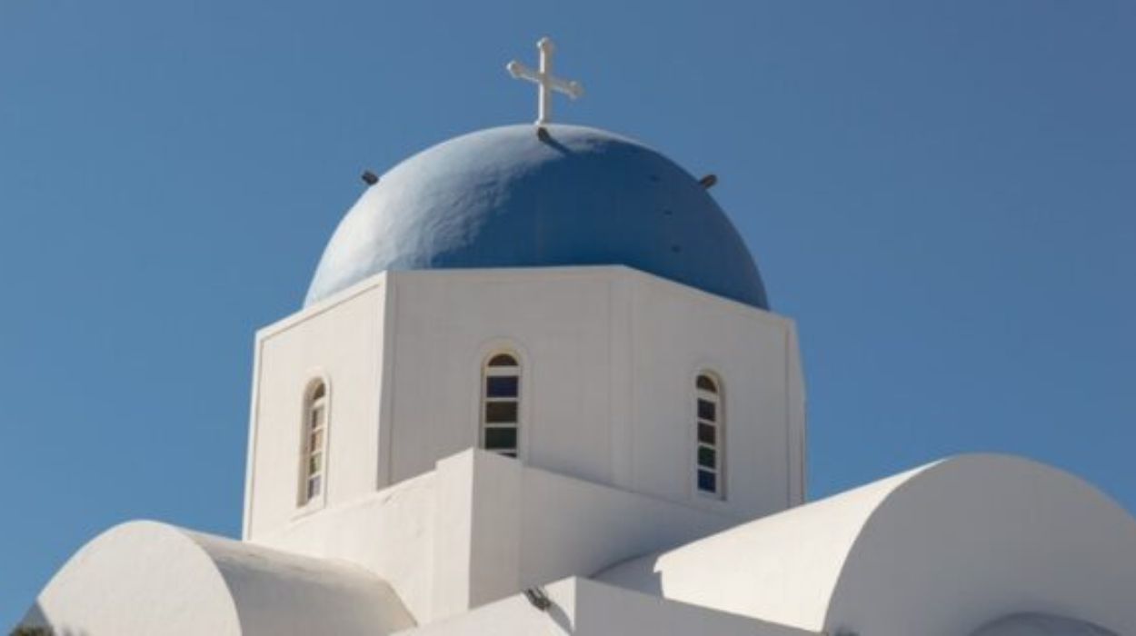Faded white buildings speak of the romantic history of Greece
