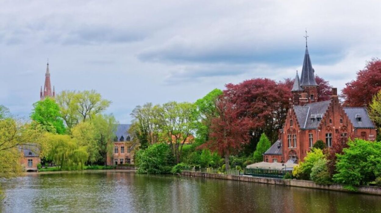 Minnewaterpark and Minnewater lake in the old town of Bruges